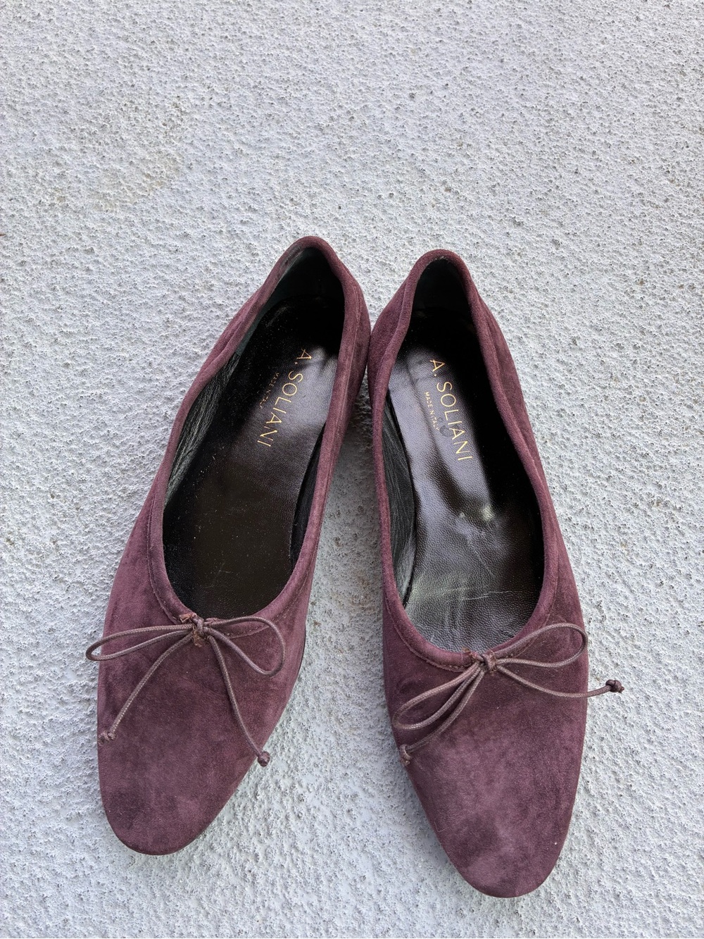 A. Solani Plum Suede Bow Ballet Flats